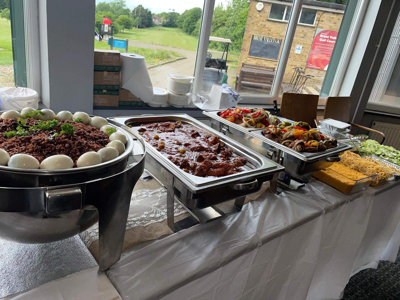Waakye with boiled eggs, rich meat stew and peppered chicken skewers on a corporate event buffet at Brent Valley Golf Course